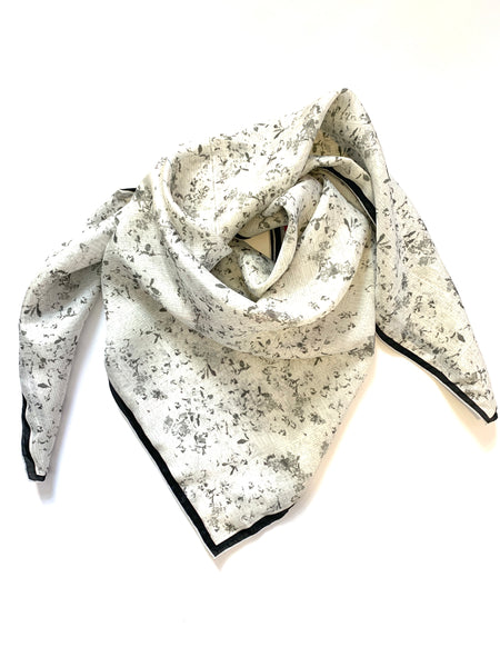 Black & White Flora Silk Scarf designed by NYC designer Tehniyet Masood in 2020. Chic gift for those who have it all. 36 inches by 36 inches. Perfect gifts for lawyers. Best silk scarves to gift, cool modern designs that elevate your chic closet. Luxurious, fashionable, beautiful, and unique. Best gifts to give in 2020