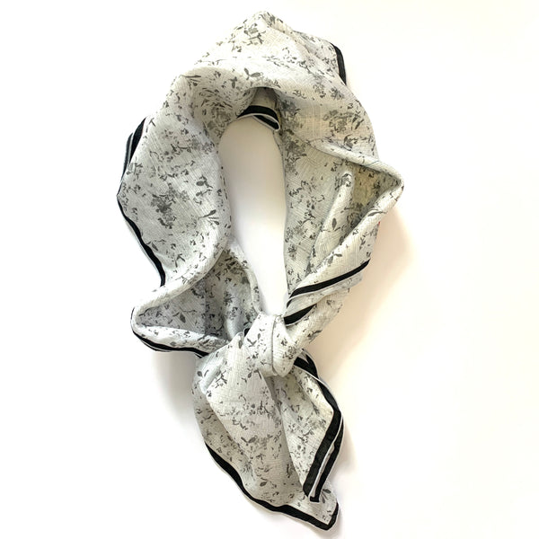 Black & White Flora Silk Scarf designed by NYC designer Tehniyet Masood in 2020. Chic gift for those who have it all. 36 inches by 36 inches. Best silk scarves to gift, cool modern designs that elevate your chic closet. Luxurious, fashionable, beautiful, and understated. Best gifts to give in 2020