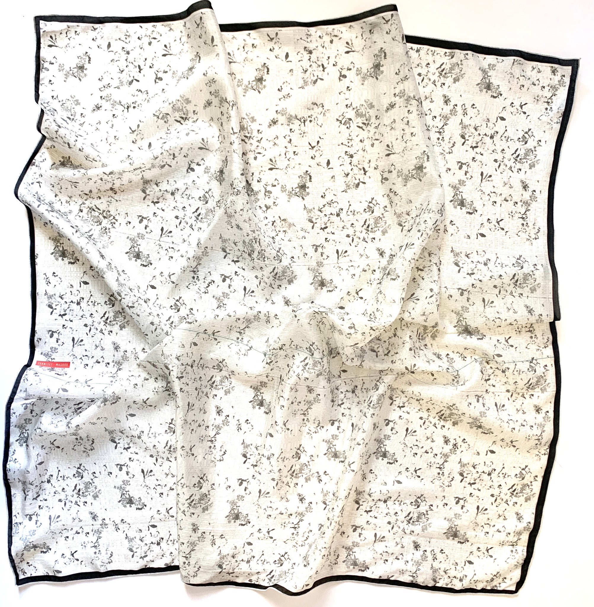Black & White Flora Silk Scarf designed by NYC designer Tehniyet Masood in 2020. Chic gift for those who have it all. 36 inches by 36 inches. Best silk scarves to gift, cool modern designs that elevate your chic closet. Luxurious, fashionable, beautiful, and unique. Best gifts to give in 2020