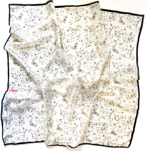 Black & White Flora Silk Scarf designed by NYC designer Tehniyet Masood in 2020. Chic gift for those who have it all. 36 inches by 36 inches. Best silk scarves to gift, cool modern designs that elevate your chic closet. Luxurious, fashionable, beautiful, and unique. Best gifts to give in 2020